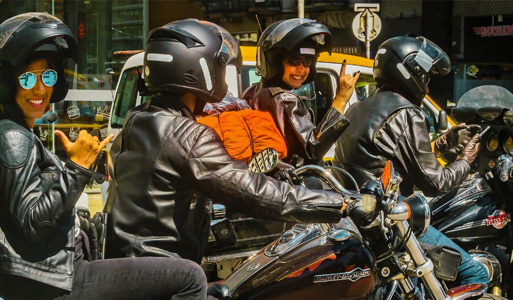 Why do motorcyclists travel in groups?
